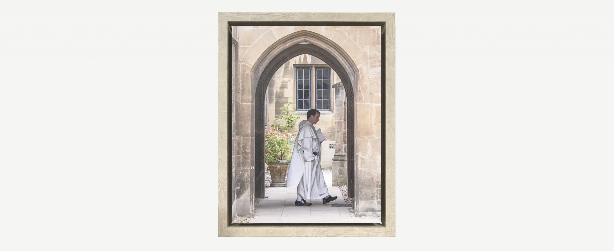 Framed photo of friar in archway